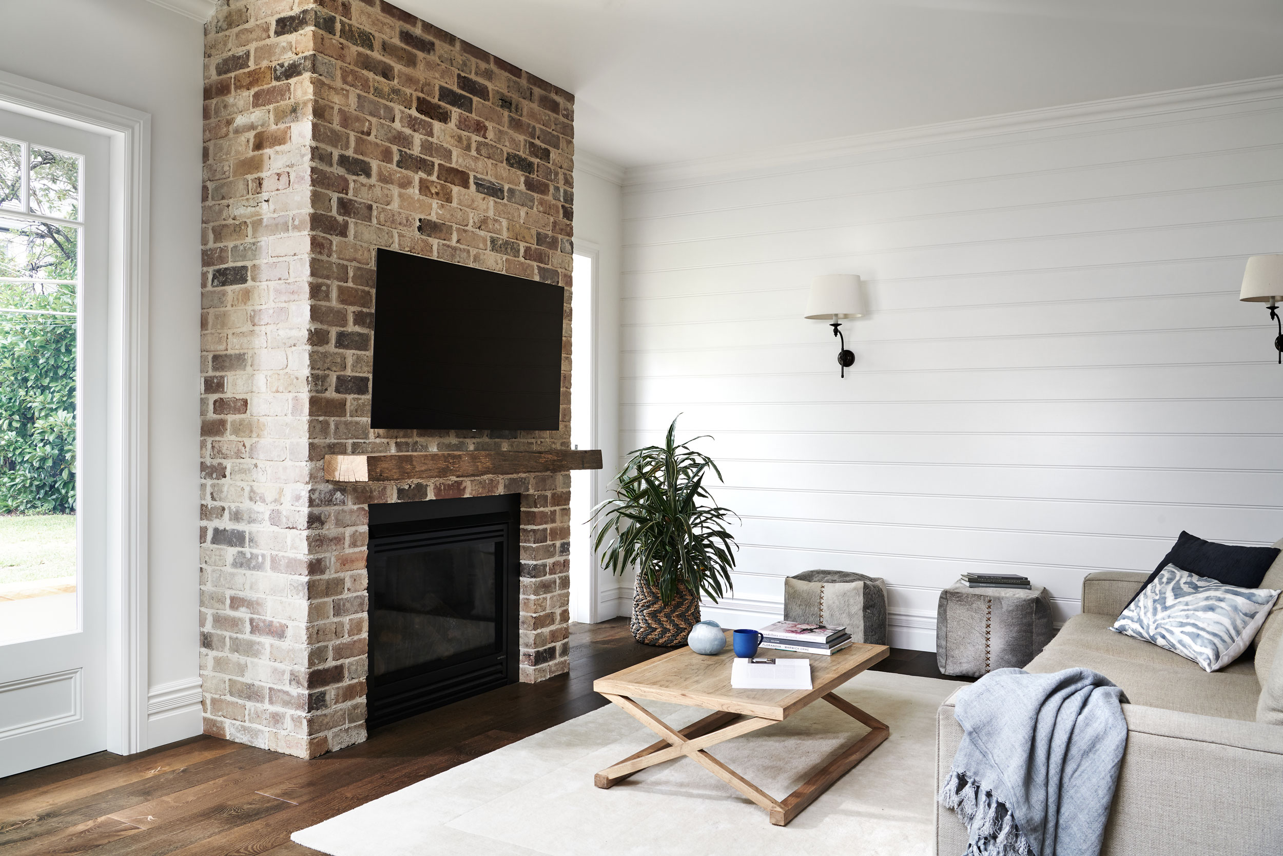 Cosy and comfortable while light and airy this Tv room in Mosman Sydney was designed by Rachel Boden Interiors