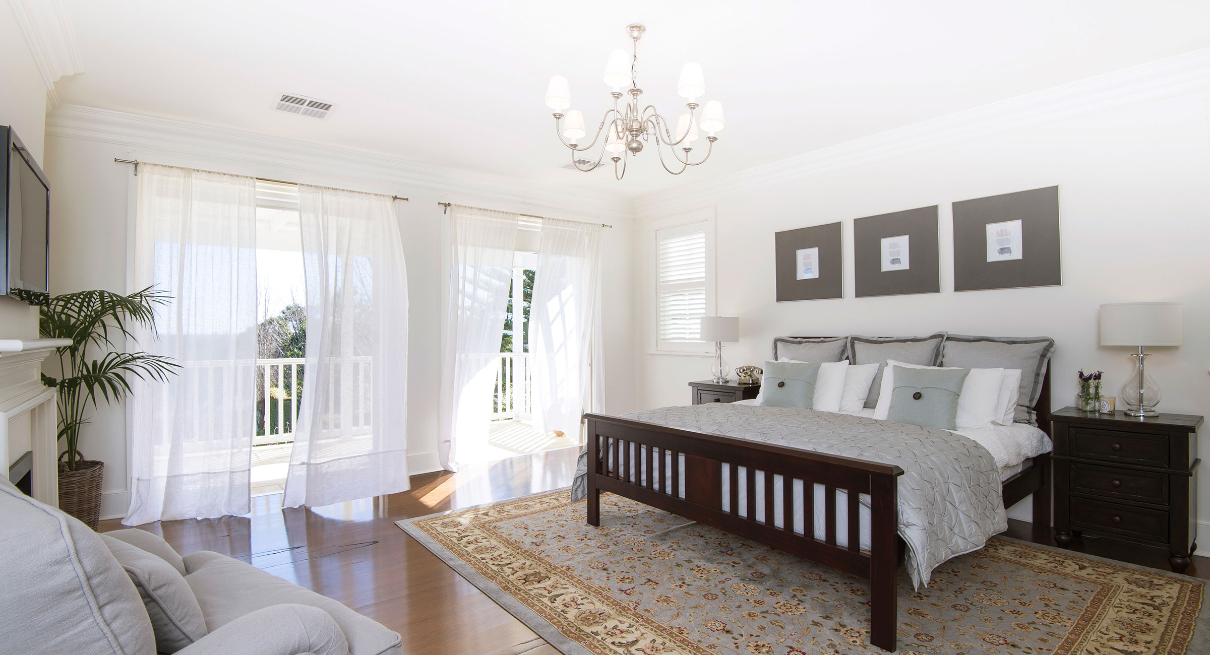 Designed by Rachel Boden Interiors this light and airy bedroom uses grey and white colour scheme with dark wood Terrey Hills Sydney Australia